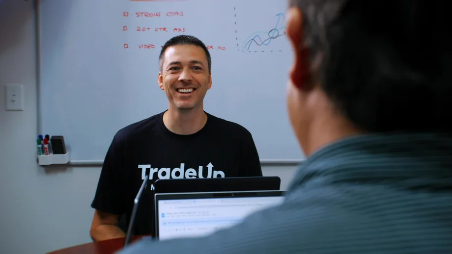 TradeUp Marketing strategist in a whiteboard strategy session with a client