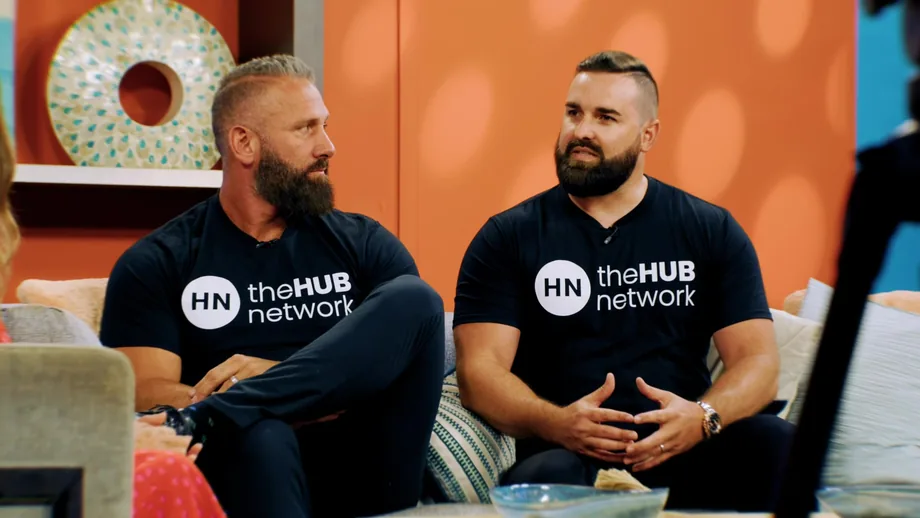 Two theHUB network hosts recording a podcast episode on set