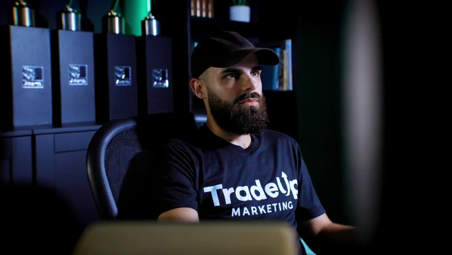 TradeUp Marketing video editor at a studio workstation