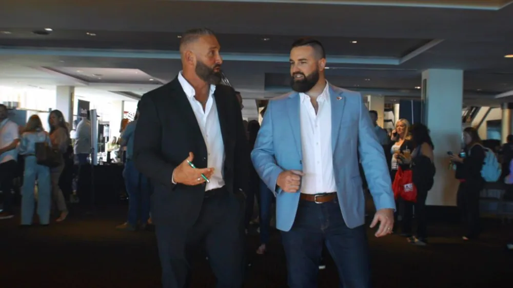 Regan Weiss talking with a colleague at an industry event