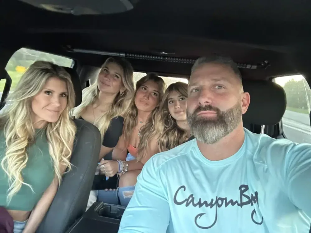 Regan Weiss with family members in a vehicle